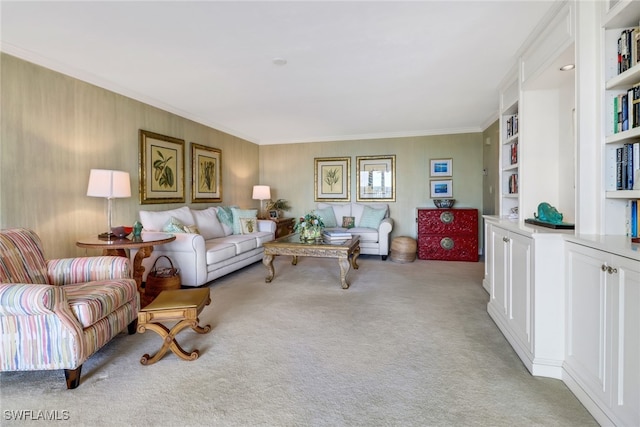 carpeted living room with built in shelves and ornamental molding