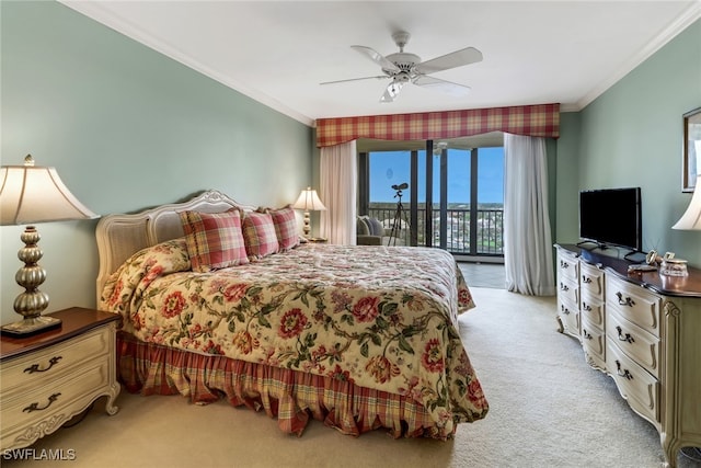 carpeted bedroom featuring access to outside, ceiling fan, and ornamental molding