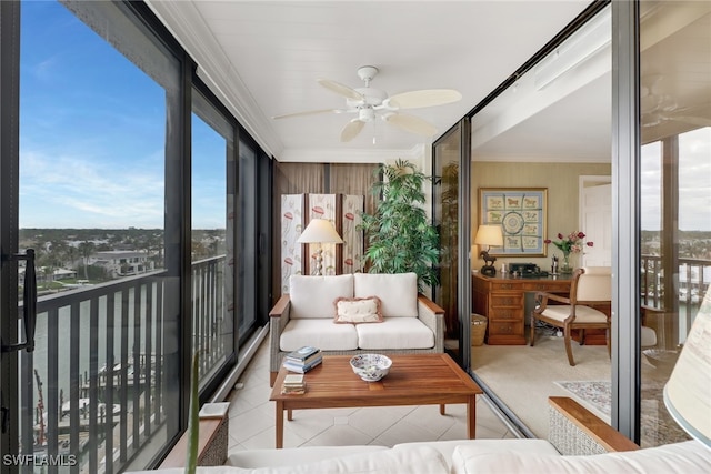 sunroom / solarium featuring ceiling fan