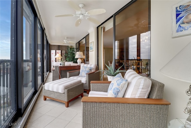 sunroom featuring ceiling fan