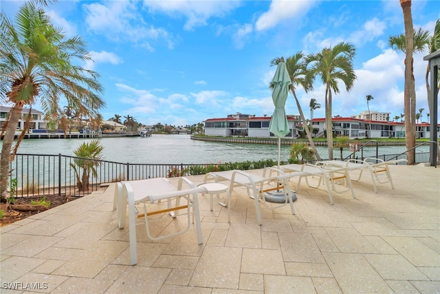 view of patio with a water view