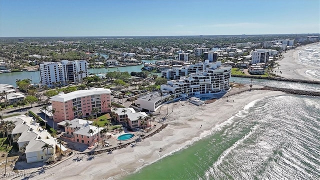 bird's eye view featuring a water view and a view of the beach