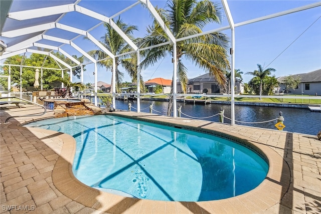 view of swimming pool featuring glass enclosure, a water view, a patio, and a dock