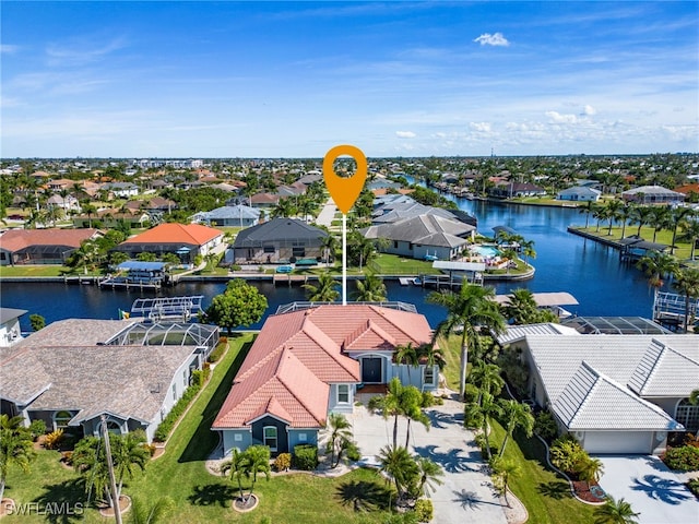 birds eye view of property with a water view