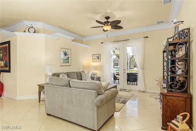 living room with french doors, light tile patterned floors, ceiling fan, and crown molding