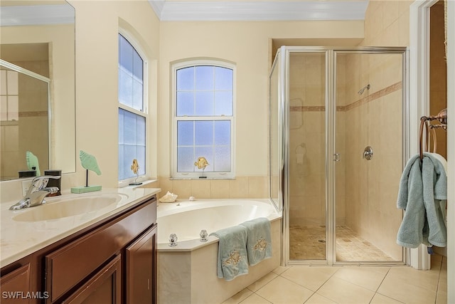 bathroom with tile patterned floors, vanity, ornamental molding, and shower with separate bathtub