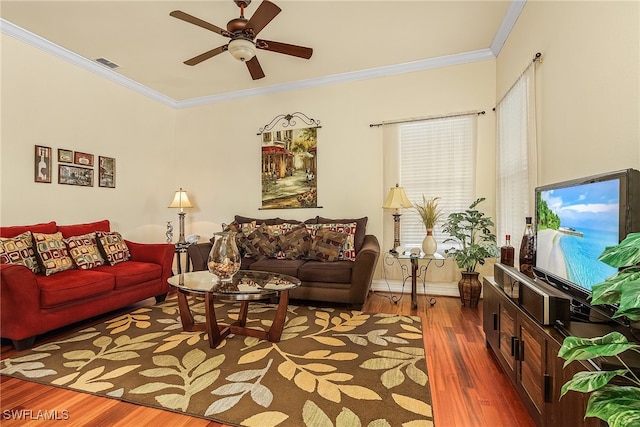 living room with ceiling fan, dark hardwood / wood-style flooring, and ornamental molding