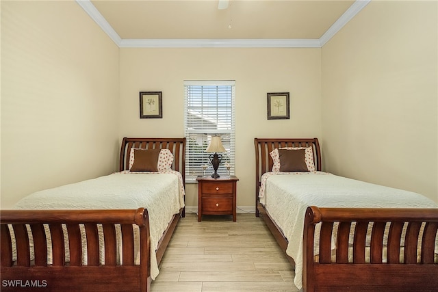 bedroom featuring ceiling fan, light hardwood / wood-style floors, and crown molding