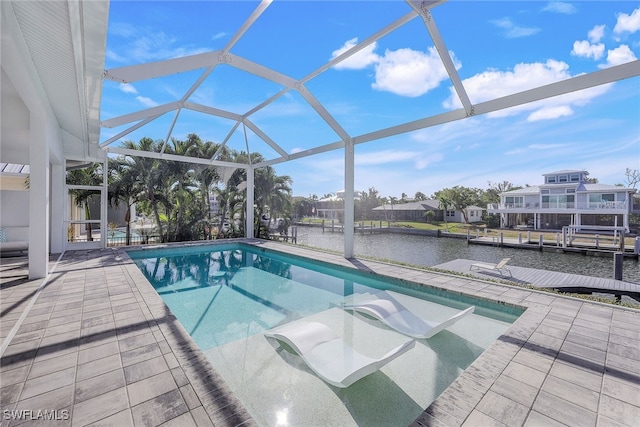 view of pool featuring a boat dock, a patio, a water view, and a lanai