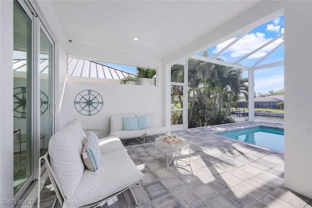 sunroom featuring a pool