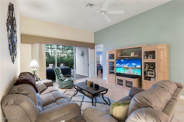 living room featuring ceiling fan and light tile patterned floors