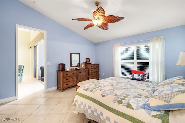 tiled bedroom featuring ceiling fan and lofted ceiling