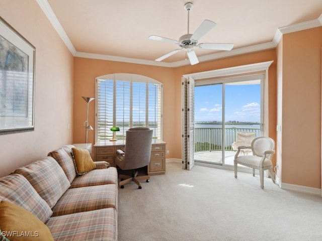 office featuring crown molding, ceiling fan, a water view, and light carpet