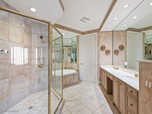 bathroom featuring vanity, tile patterned flooring, and plus walk in shower