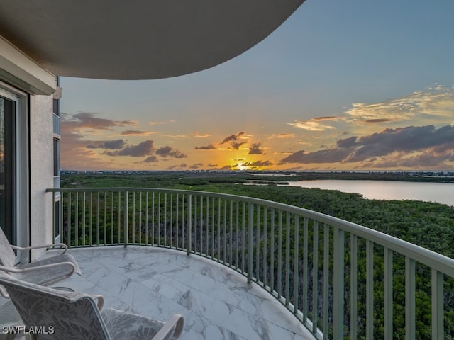 balcony at dusk with a water view