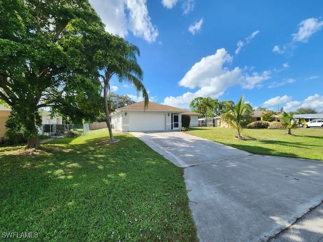 single story home featuring a garage and a front yard