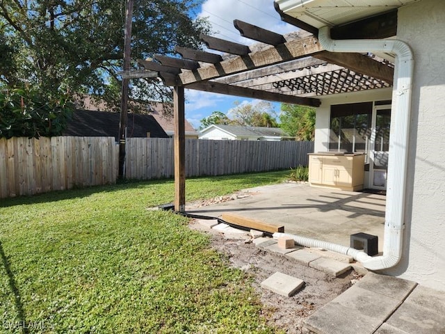 view of yard with a pergola and a patio