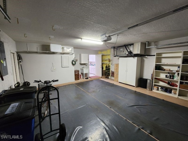 garage featuring a garage door opener and sink