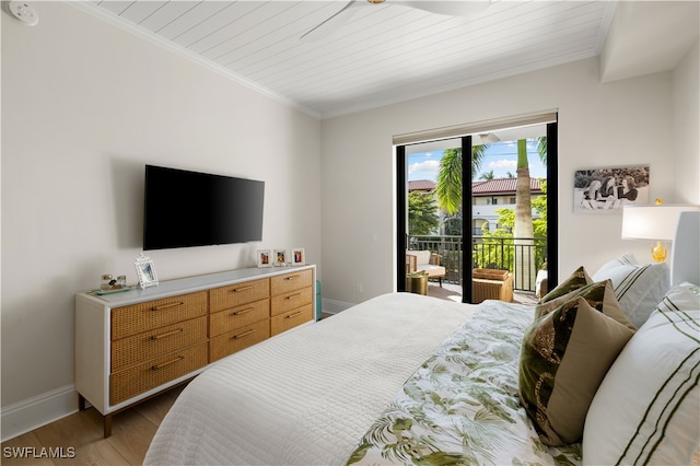 bedroom featuring access to outside, light hardwood / wood-style flooring, ornamental molding, and wood ceiling