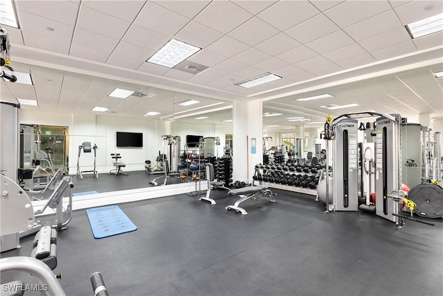 workout area with a paneled ceiling