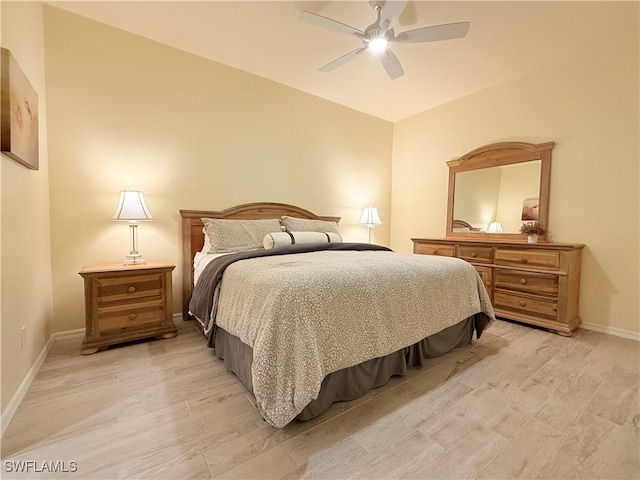 bedroom with ceiling fan and light hardwood / wood-style floors