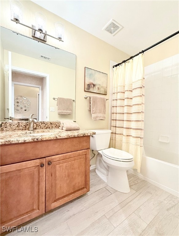 full bathroom with vanity, toilet, wood-type flooring, and shower / tub combo with curtain