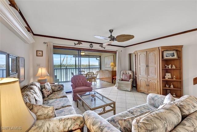 living room with ceiling fan, a water view, light tile patterned floors, and ornamental molding