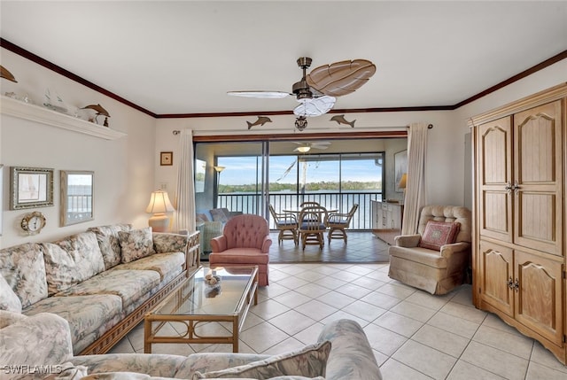 living room featuring ceiling fan, light tile patterned floors, and ornamental molding