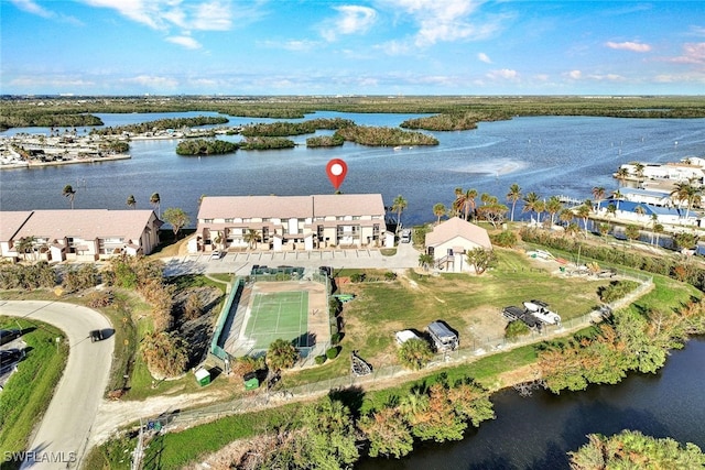 birds eye view of property with a water view