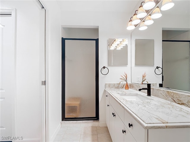 bathroom featuring vanity, tile patterned floors, and an enclosed shower