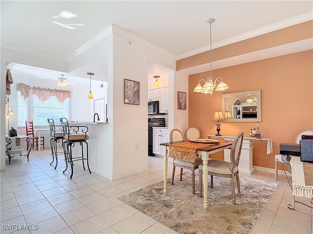 tiled dining space with ceiling fan with notable chandelier and crown molding