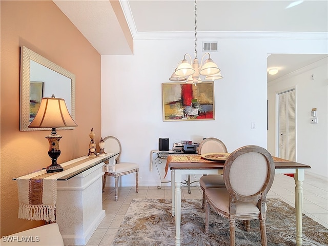 dining space with light tile patterned flooring, a notable chandelier, and ornamental molding