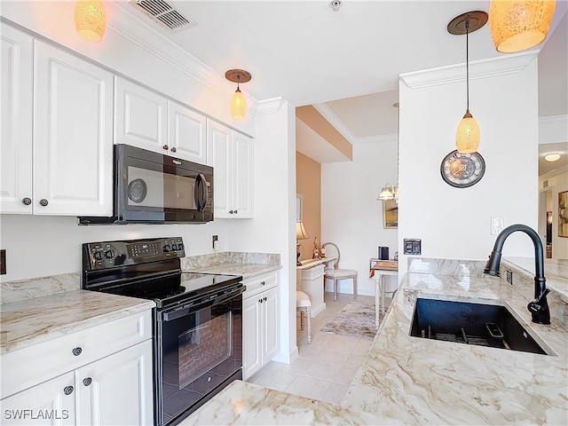 kitchen featuring pendant lighting, white cabinets, black appliances, and sink