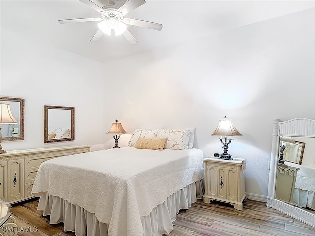 bedroom featuring ceiling fan and light hardwood / wood-style flooring