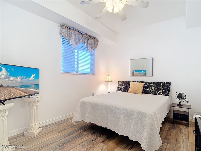 bedroom featuring ceiling fan and hardwood / wood-style flooring