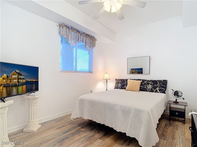 bedroom featuring hardwood / wood-style floors and ceiling fan