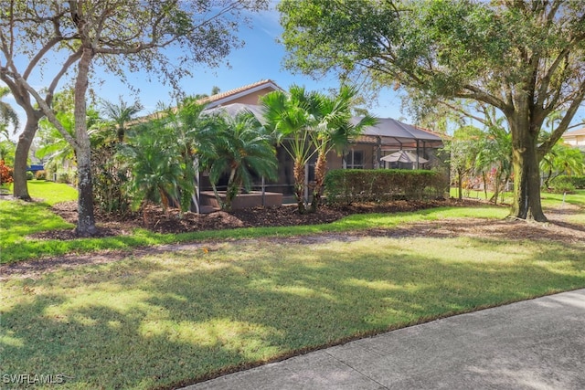 view of yard with a lanai