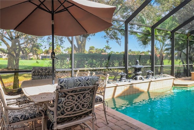 outdoor pool with a lanai and a patio