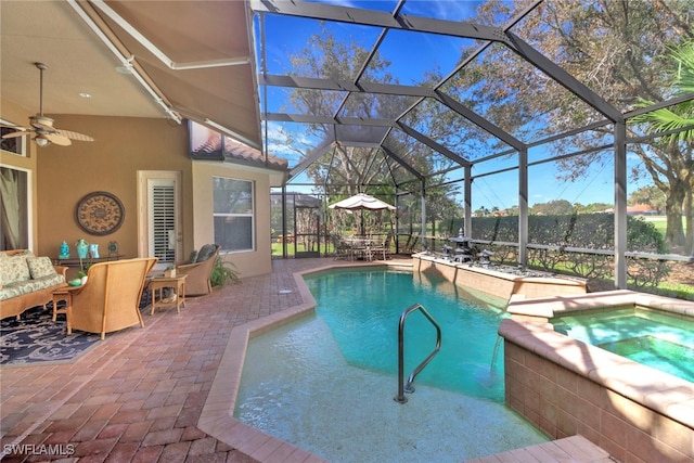 view of swimming pool featuring glass enclosure, ceiling fan, a patio area, and an in ground hot tub