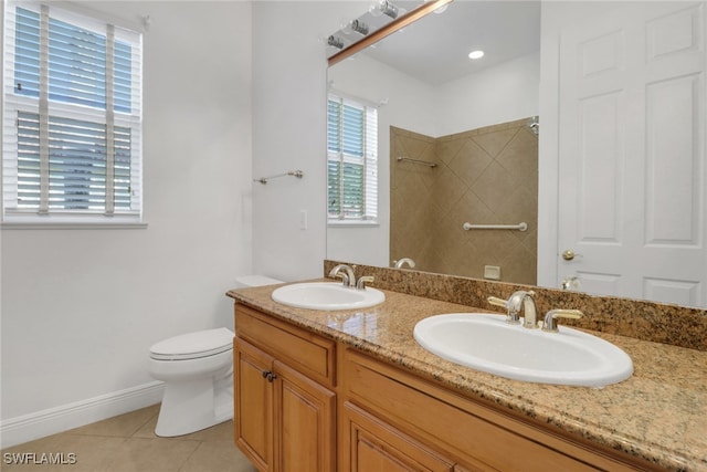 bathroom with toilet, a sink, tile patterned flooring, and a shower
