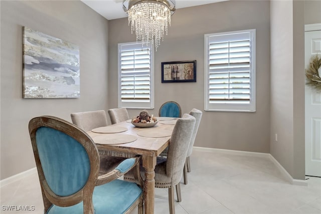 dining space featuring a notable chandelier and a wealth of natural light