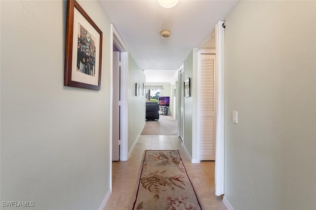 hallway with light tile patterned floors