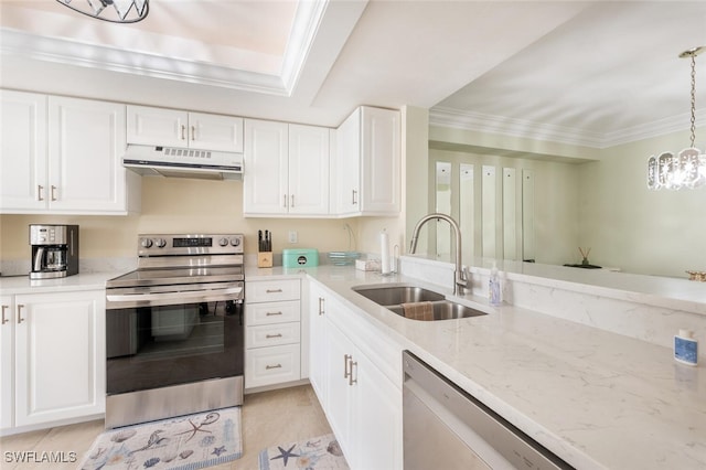 kitchen featuring decorative light fixtures, stainless steel appliances, white cabinetry, and sink