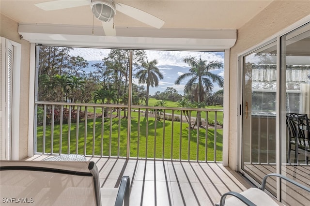 sunroom / solarium with ceiling fan