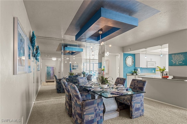 dining room featuring light colored carpet