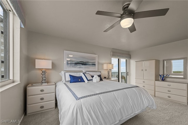 bedroom with ceiling fan and light colored carpet