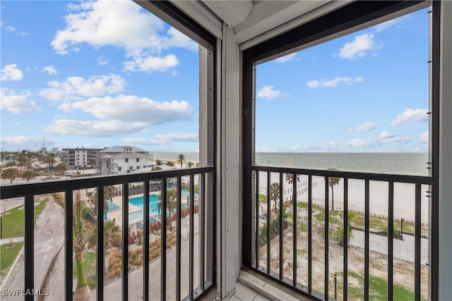 balcony with a view of the beach and a water view