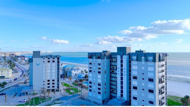 aerial view featuring a water view and a beach view