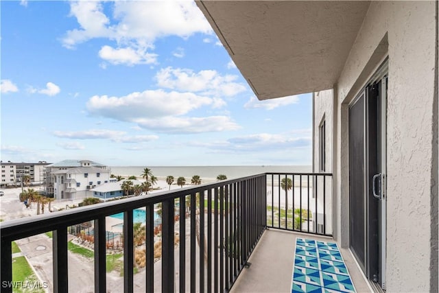 balcony featuring a water view