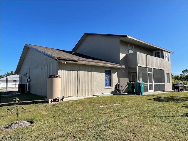 rear view of house with a lawn